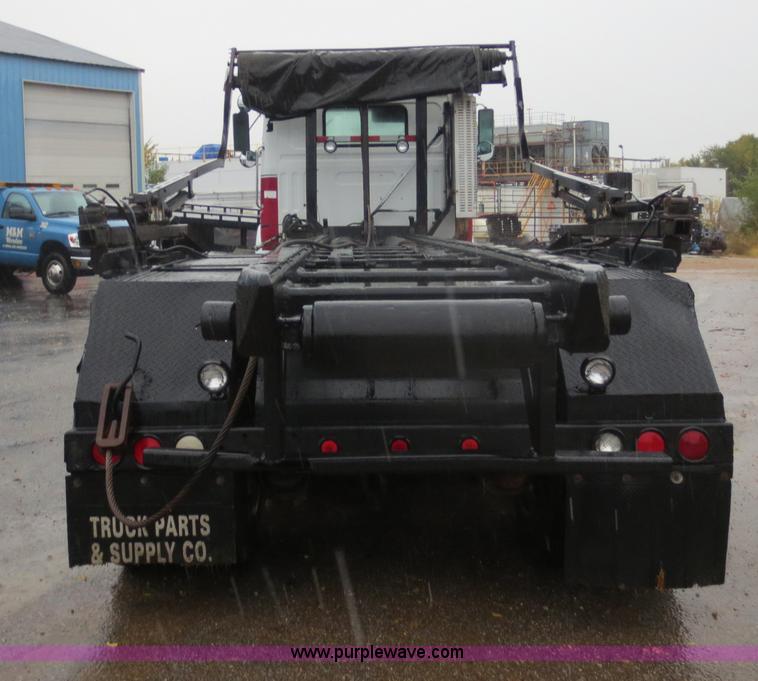 image for item F8010 1996 Volvo WG roll off truck