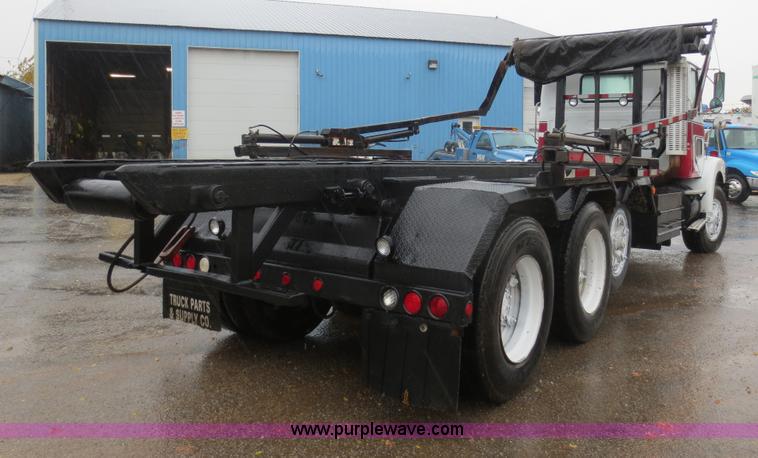 image for item F8010 1996 Volvo WG roll off truck