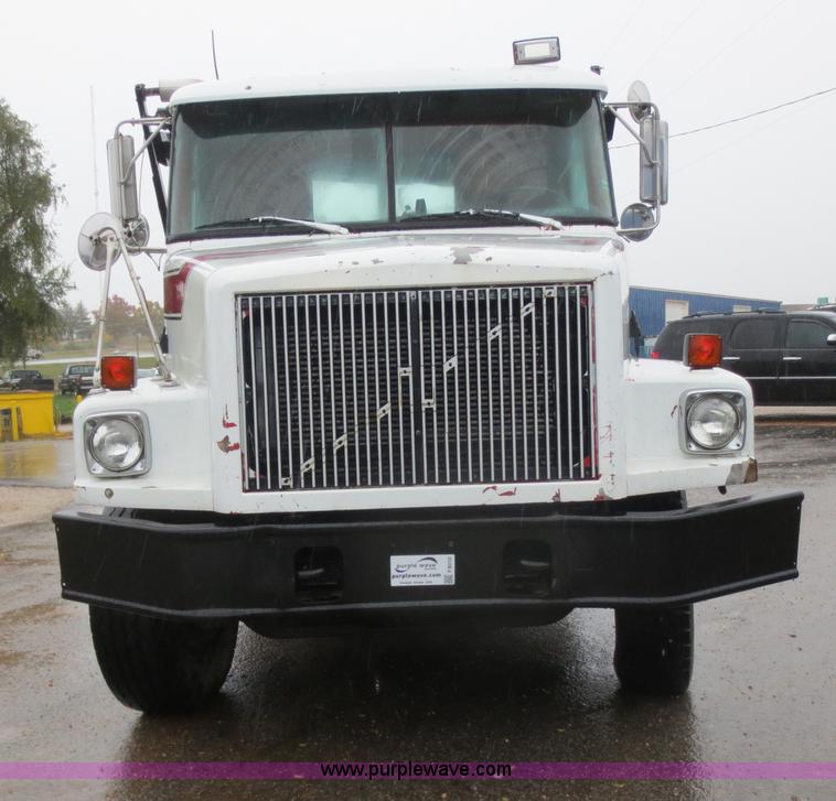 image for item F8010 1996 Volvo WG roll off truck