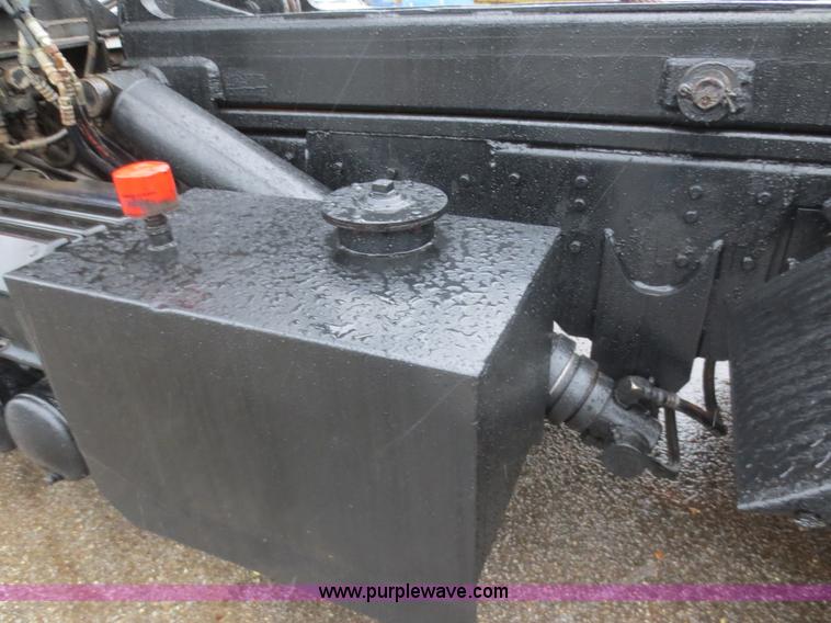 image for item F8010 1996 Volvo WG roll off truck