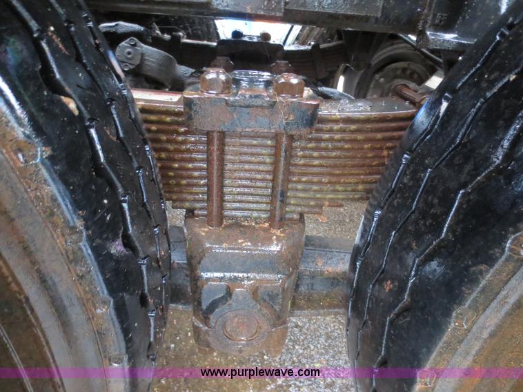 image for item F8010 1996 Volvo WG roll off truck