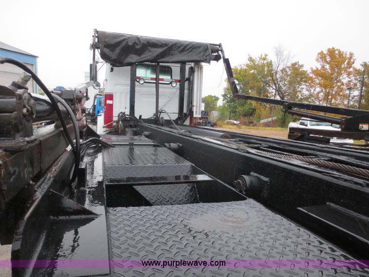 image for item F8010 1996 Volvo WG roll off truck