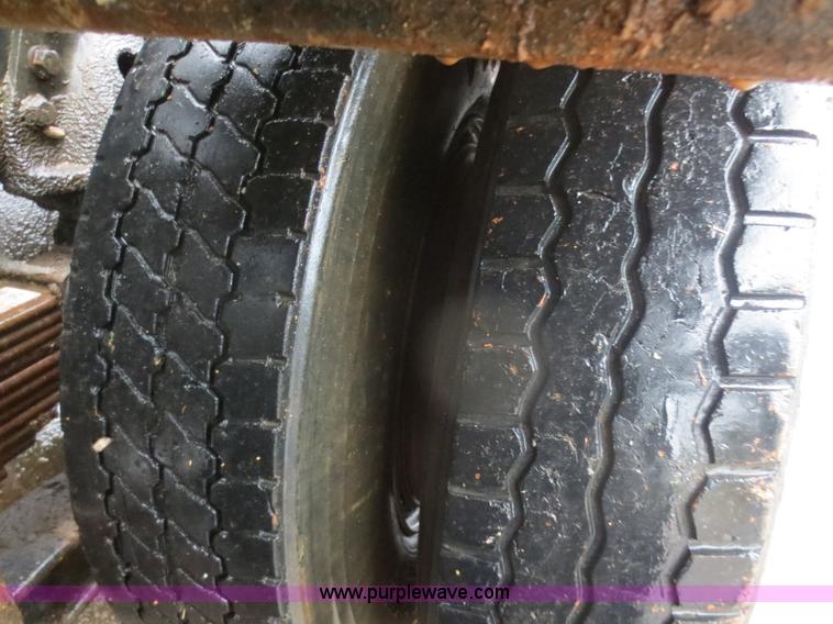 image for item F8010 1996 Volvo WG roll off truck