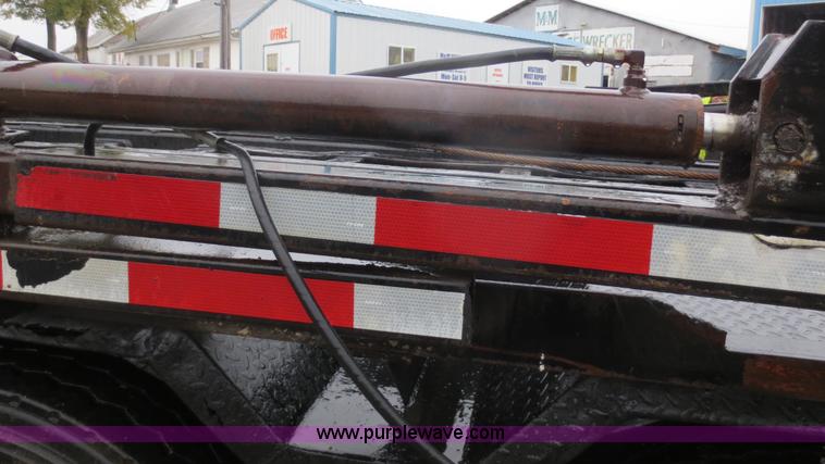 image for item F8010 1996 Volvo WG roll off truck