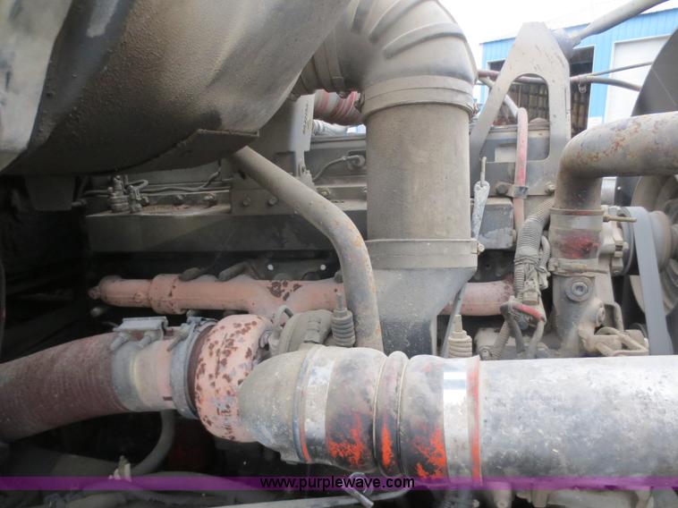 image for item F8010 1996 Volvo WG roll off truck