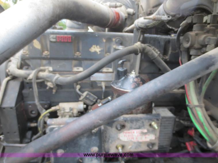 image for item F8010 1996 Volvo WG roll off truck