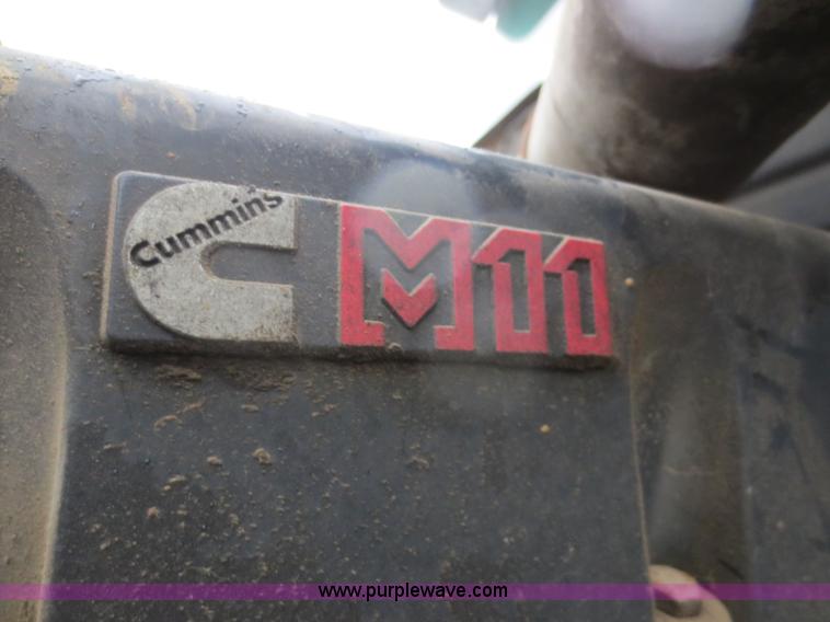 image for item F8010 1996 Volvo WG roll off truck