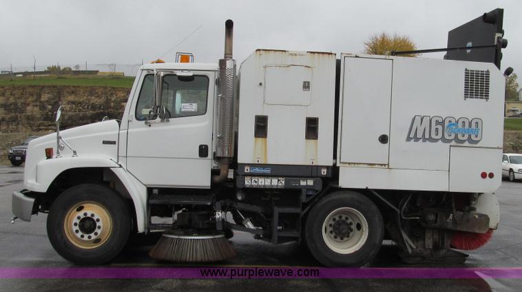 image for item G2173 2003 Freightliner FL70 truck with Schwarze M6000 sweeper
