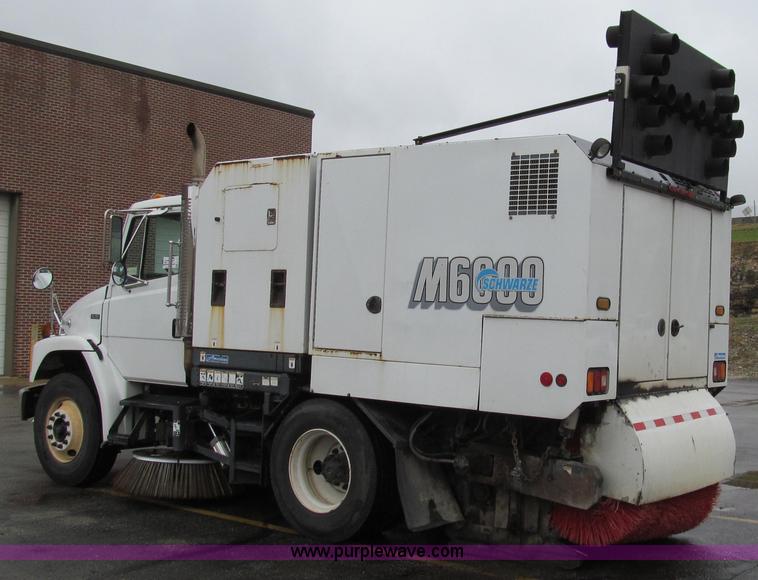 image for item G2173 2003 Freightliner FL70 truck with Schwarze M6000 sweeper