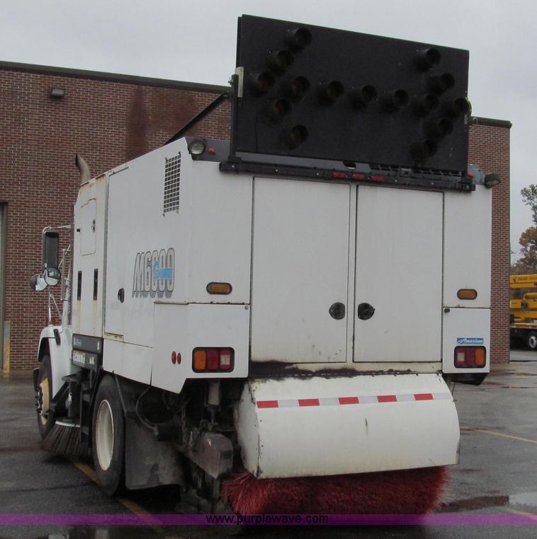 image for item G2173 2003 Freightliner FL70 truck with Schwarze M6000 sweeper