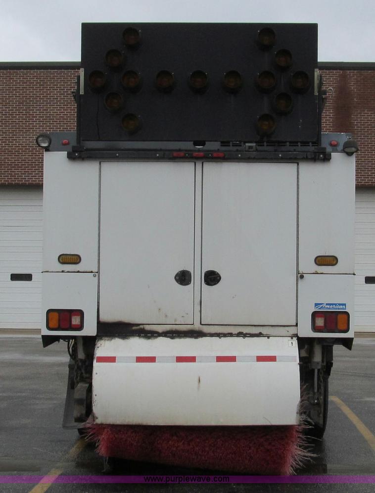 image for item G2173 2003 Freightliner FL70 truck with Schwarze M6000 sweeper