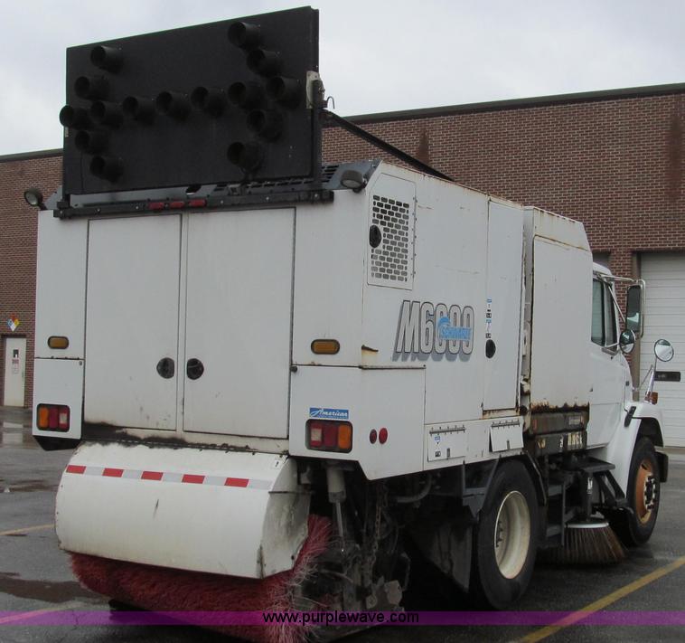 image for item G2173 2003 Freightliner FL70 truck with Schwarze M6000 sweeper