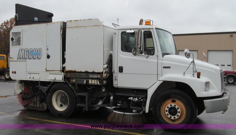 image for item G2173 2003 Freightliner FL70 truck with Schwarze M6000 sweeper
