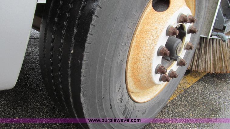 image for item G2173 2003 Freightliner FL70 truck with Schwarze M6000 sweeper