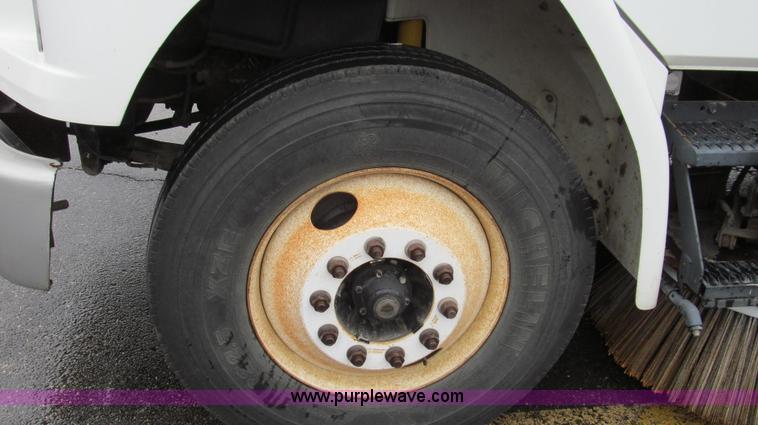 image for item G2173 2003 Freightliner FL70 truck with Schwarze M6000 sweeper