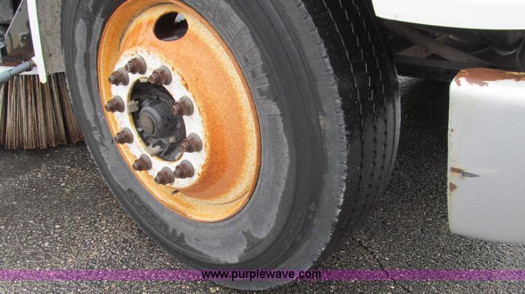 image for item G2173 2003 Freightliner FL70 truck with Schwarze M6000 sweeper