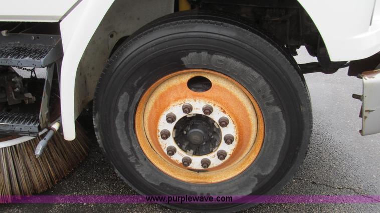 image for item G2173 2003 Freightliner FL70 truck with Schwarze M6000 sweeper