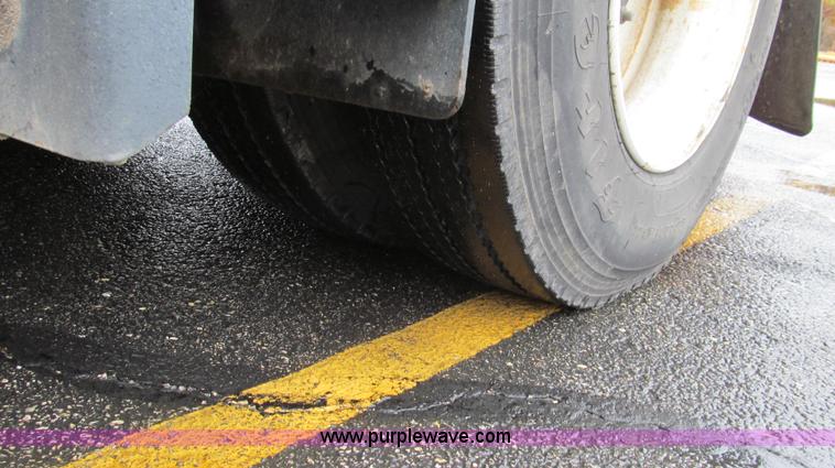 image for item G2173 2003 Freightliner FL70 truck with Schwarze M6000 sweeper