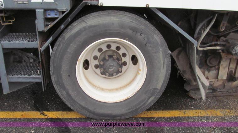 image for item G2173 2003 Freightliner FL70 truck with Schwarze M6000 sweeper