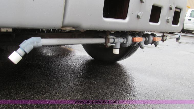 image for item G2173 2003 Freightliner FL70 truck with Schwarze M6000 sweeper