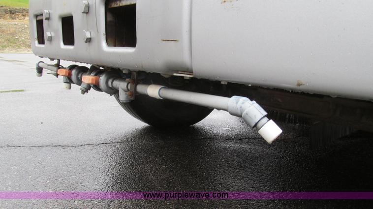 image for item G2173 2003 Freightliner FL70 truck with Schwarze M6000 sweeper