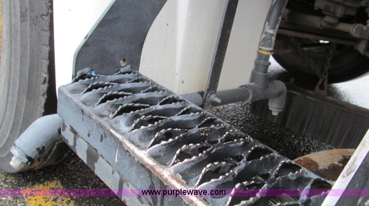 image for item G2173 2003 Freightliner FL70 truck with Schwarze M6000 sweeper