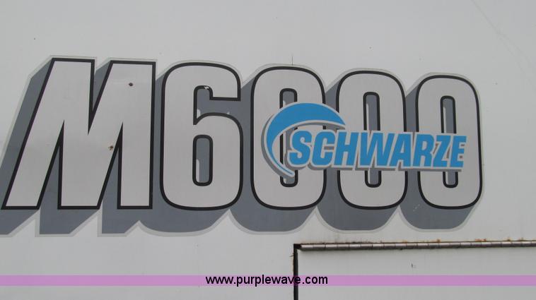 image for item G2173 2003 Freightliner FL70 truck with Schwarze M6000 sweeper