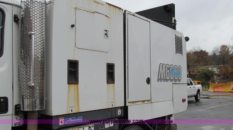 image for item G2173 2003 Freightliner FL70 truck with Schwarze M6000 sweeper