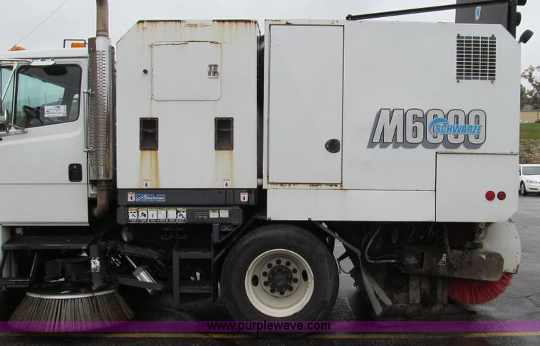 image for item G2173 2003 Freightliner FL70 truck with Schwarze M6000 sweeper