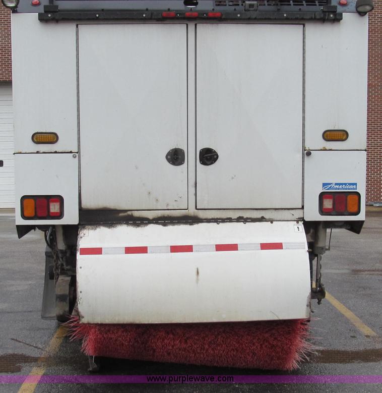 image for item G2173 2003 Freightliner FL70 truck with Schwarze M6000 sweeper