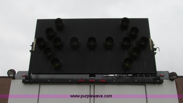 image for item G2173 2003 Freightliner FL70 truck with Schwarze M6000 sweeper