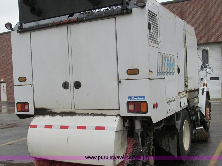image for item G2173 2003 Freightliner FL70 truck with Schwarze M6000 sweeper