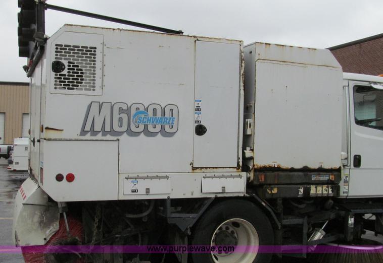 image for item G2173 2003 Freightliner FL70 truck with Schwarze M6000 sweeper