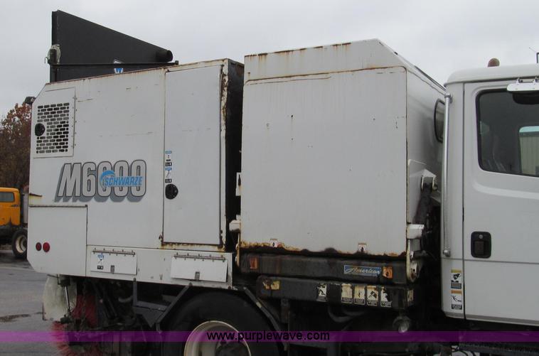 image for item G2173 2003 Freightliner FL70 truck with Schwarze M6000 sweeper