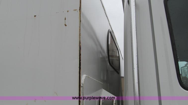 image for item G2173 2003 Freightliner FL70 truck with Schwarze M6000 sweeper