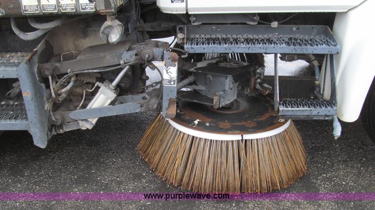 image for item G2173 2003 Freightliner FL70 truck with Schwarze M6000 sweeper