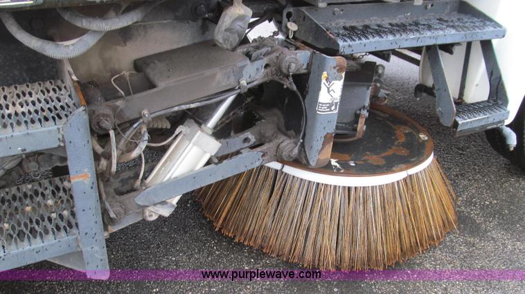 image for item G2173 2003 Freightliner FL70 truck with Schwarze M6000 sweeper