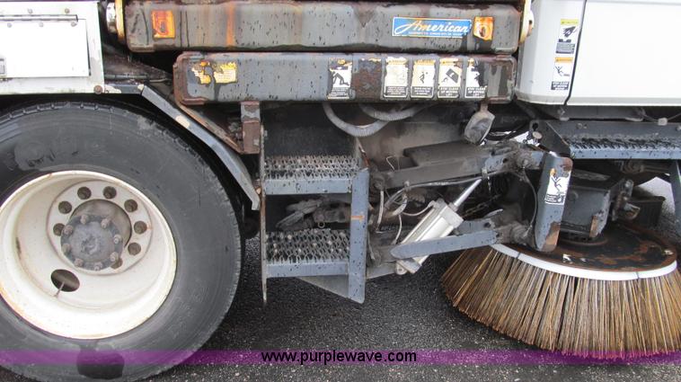 image for item G2173 2003 Freightliner FL70 truck with Schwarze M6000 sweeper