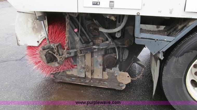 image for item G2173 2003 Freightliner FL70 truck with Schwarze M6000 sweeper