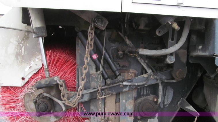 image for item G2173 2003 Freightliner FL70 truck with Schwarze M6000 sweeper