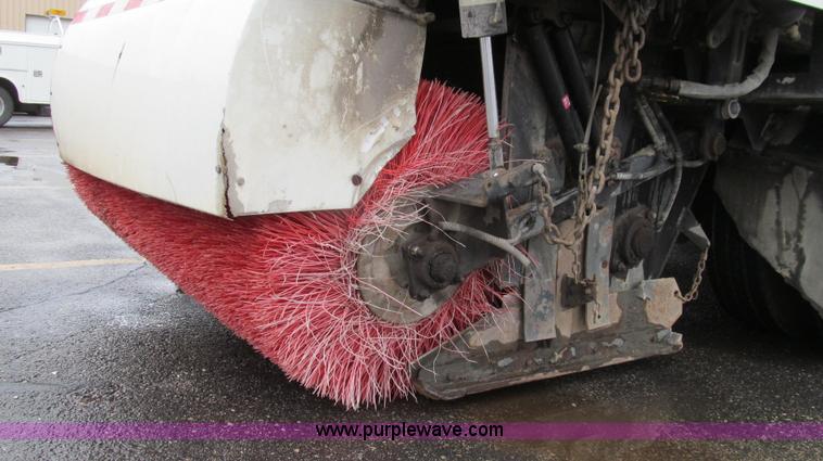 image for item G2173 2003 Freightliner FL70 truck with Schwarze M6000 sweeper