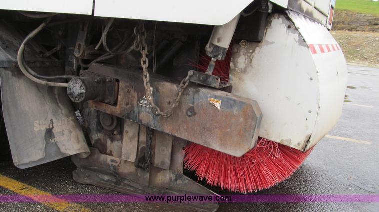 image for item G2173 2003 Freightliner FL70 truck with Schwarze M6000 sweeper