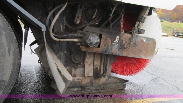 image for item G2173 2003 Freightliner FL70 truck with Schwarze M6000 sweeper