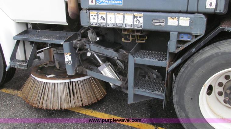 image for item G2173 2003 Freightliner FL70 truck with Schwarze M6000 sweeper