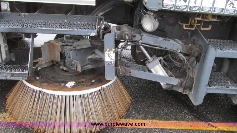 image for item G2173 2003 Freightliner FL70 truck with Schwarze M6000 sweeper