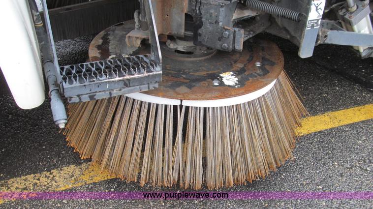 image for item G2173 2003 Freightliner FL70 truck with Schwarze M6000 sweeper