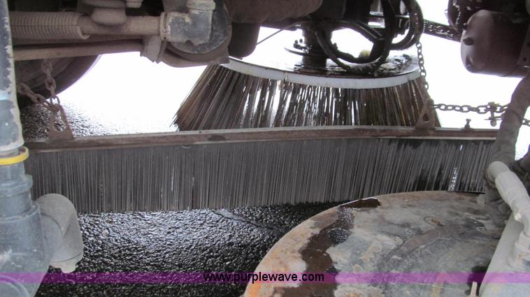 image for item G2173 2003 Freightliner FL70 truck with Schwarze M6000 sweeper