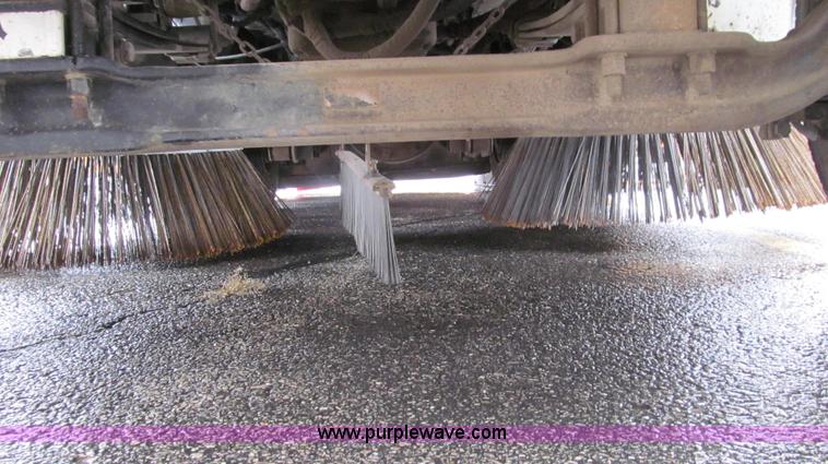 image for item G2173 2003 Freightliner FL70 truck with Schwarze M6000 sweeper