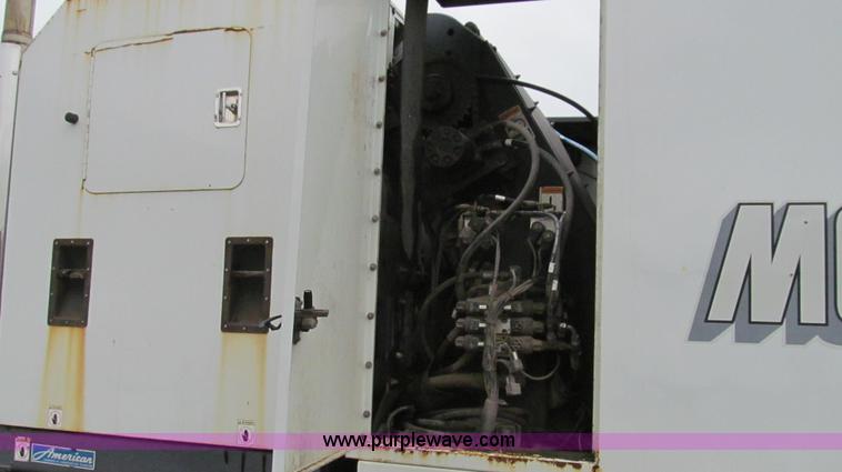 image for item G2173 2003 Freightliner FL70 truck with Schwarze M6000 sweeper