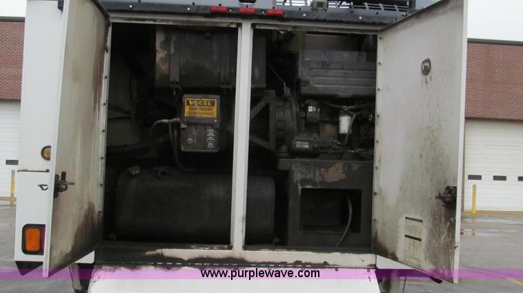 image for item G2173 2003 Freightliner FL70 truck with Schwarze M6000 sweeper